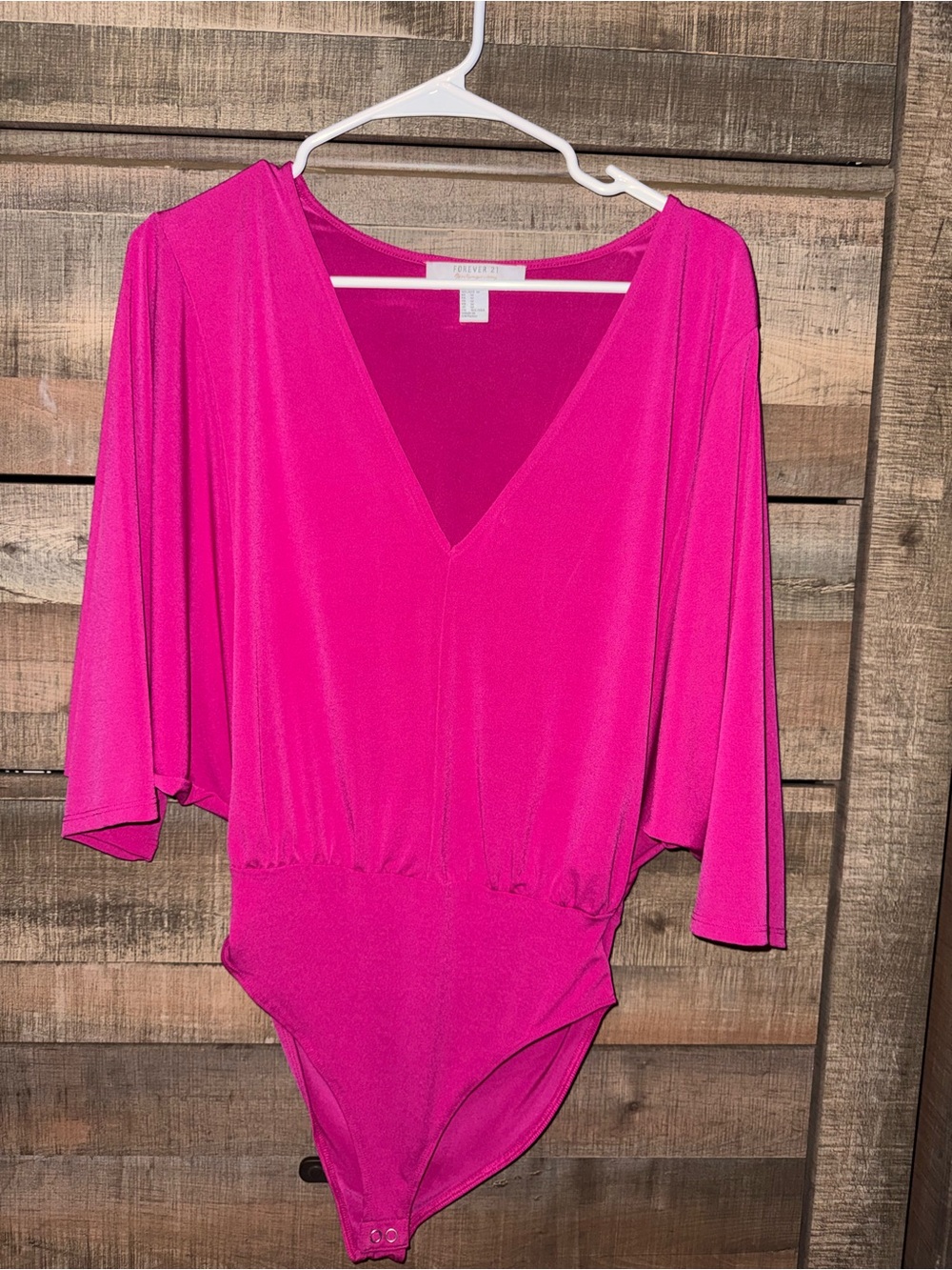 Hot pink flowy top bodysuit.